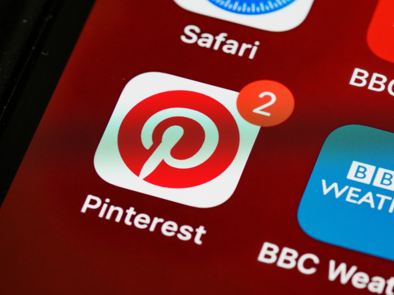 closeup photo of pinterest icon in smartphone apps menu