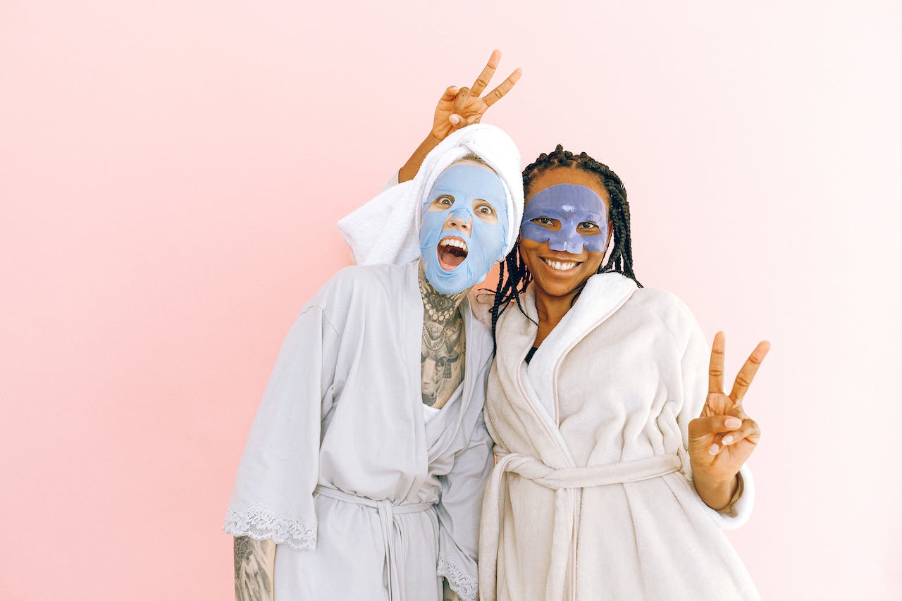 Two ladies in robes and face masks