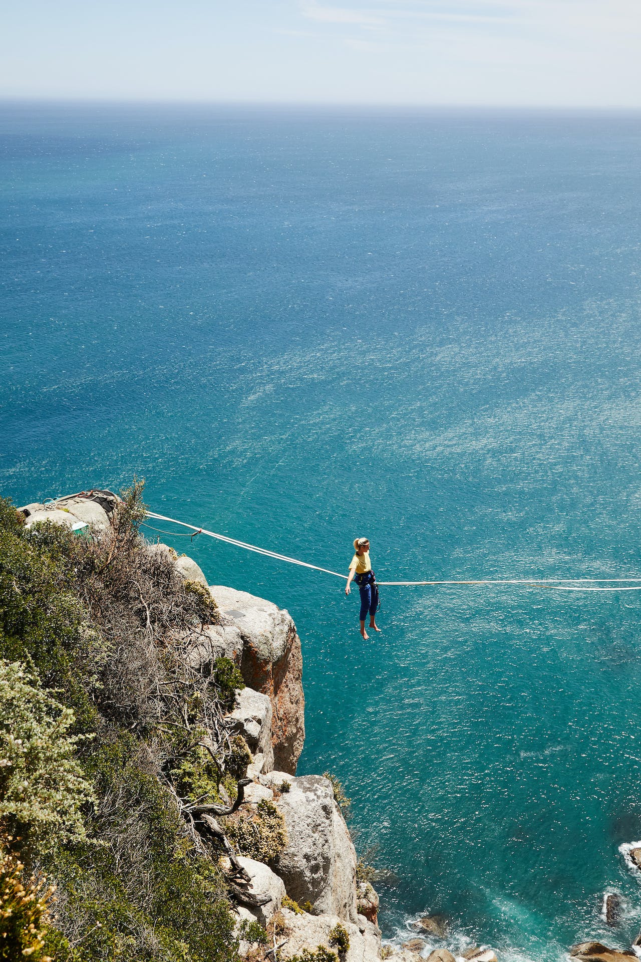 man on highline between to cliffs